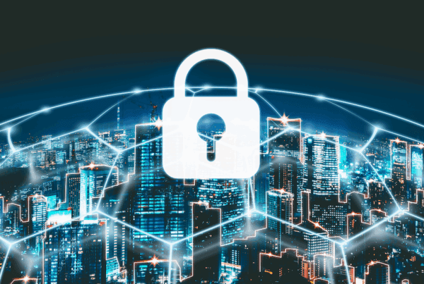 Cyber-Liability-Insurance-is-Critical-to-Municipalities-and-Law-Firms-Graphic-image-of-city-buildings-with-white-lock